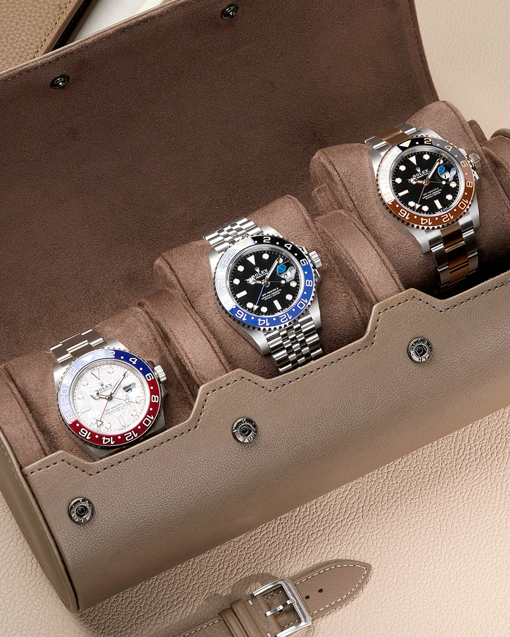 Opened 3 Slot Watch Roll in taupe with three Rolex watches inside