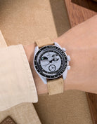 Omega X Swatch Mission to Earthphase with beige suede leather strap worn on wrist