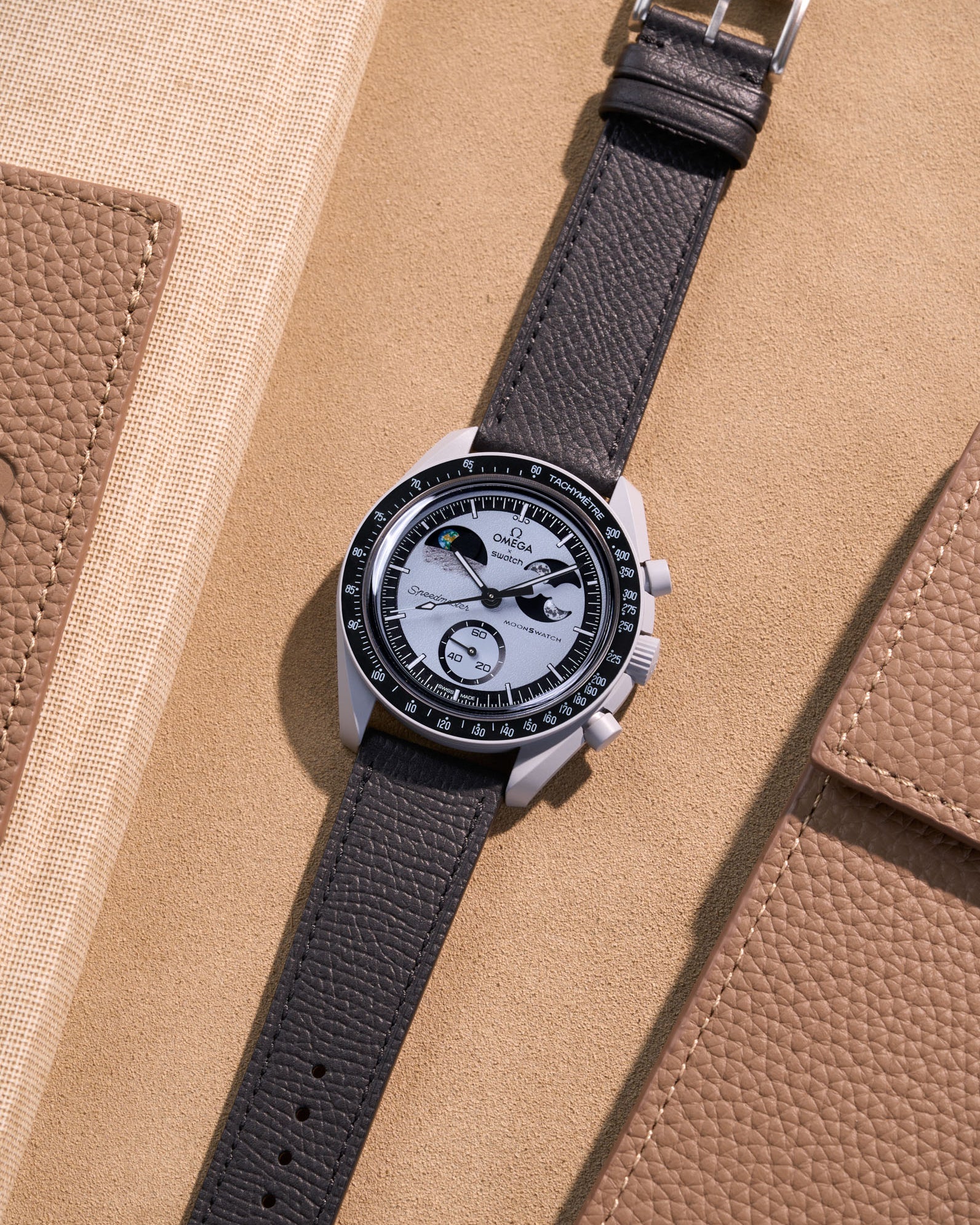 Flat lay of Black Epsom leather strap for Omega x Swatch MoonSwatch Mission to Earthphase