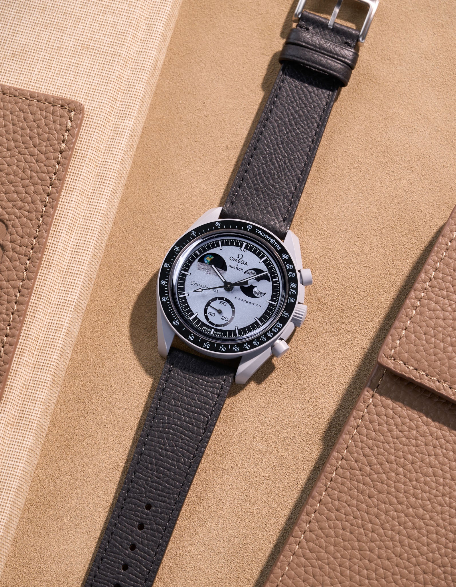Flat lay of Black Epsom leather strap for Omega x Swatch MoonSwatch Mission to Earthphase