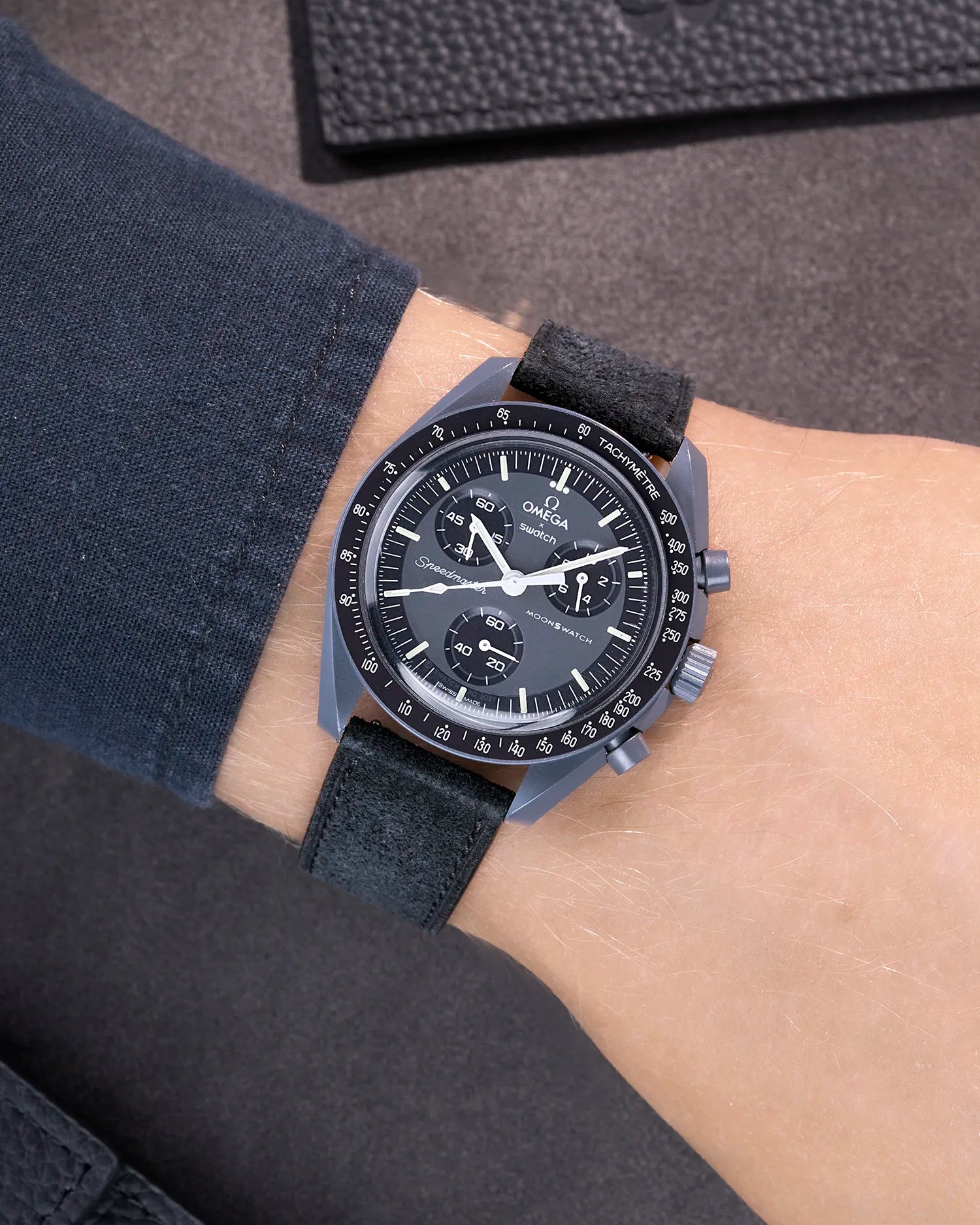 Omega X Swatch Mission to Mercury with Black suede leather strap worn on wrist