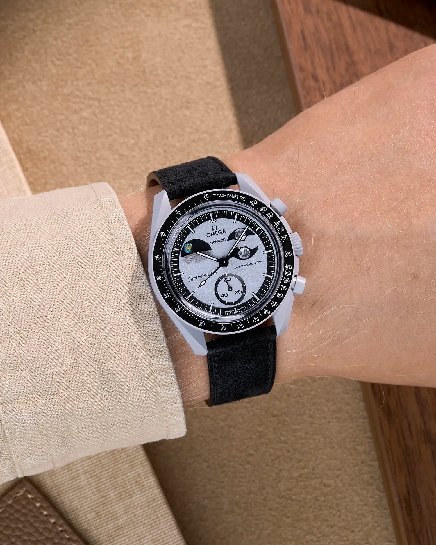 Omega X Swatch Mission to Earthphase with black suede leather strap worn on wrist