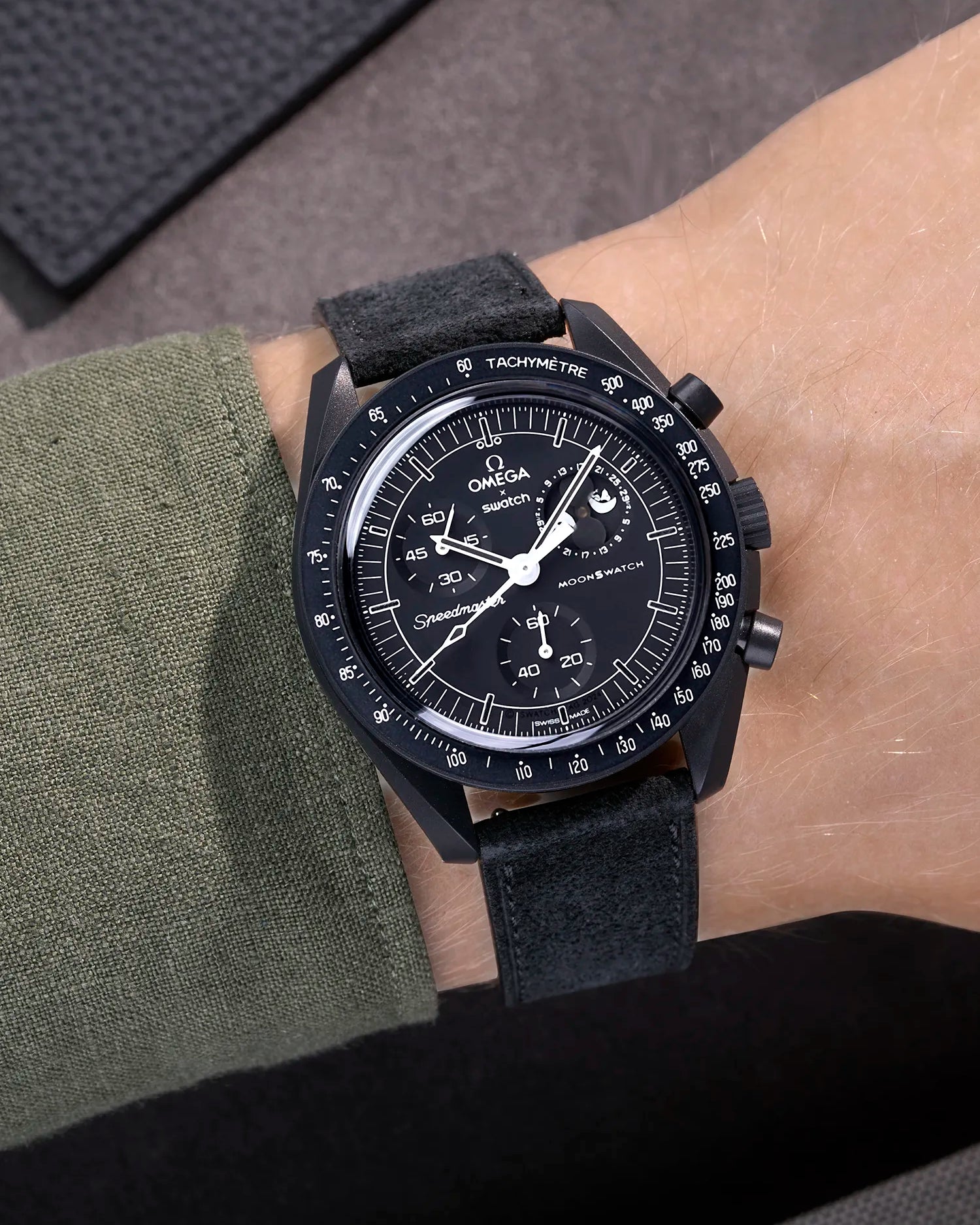 Omega X Swatch Mission to the Moonphase New Moon with black suede leather strap worn on wrist