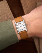 Brown Epsom Leather Straps for Cartier Tank Must Large wrist shot over brown table