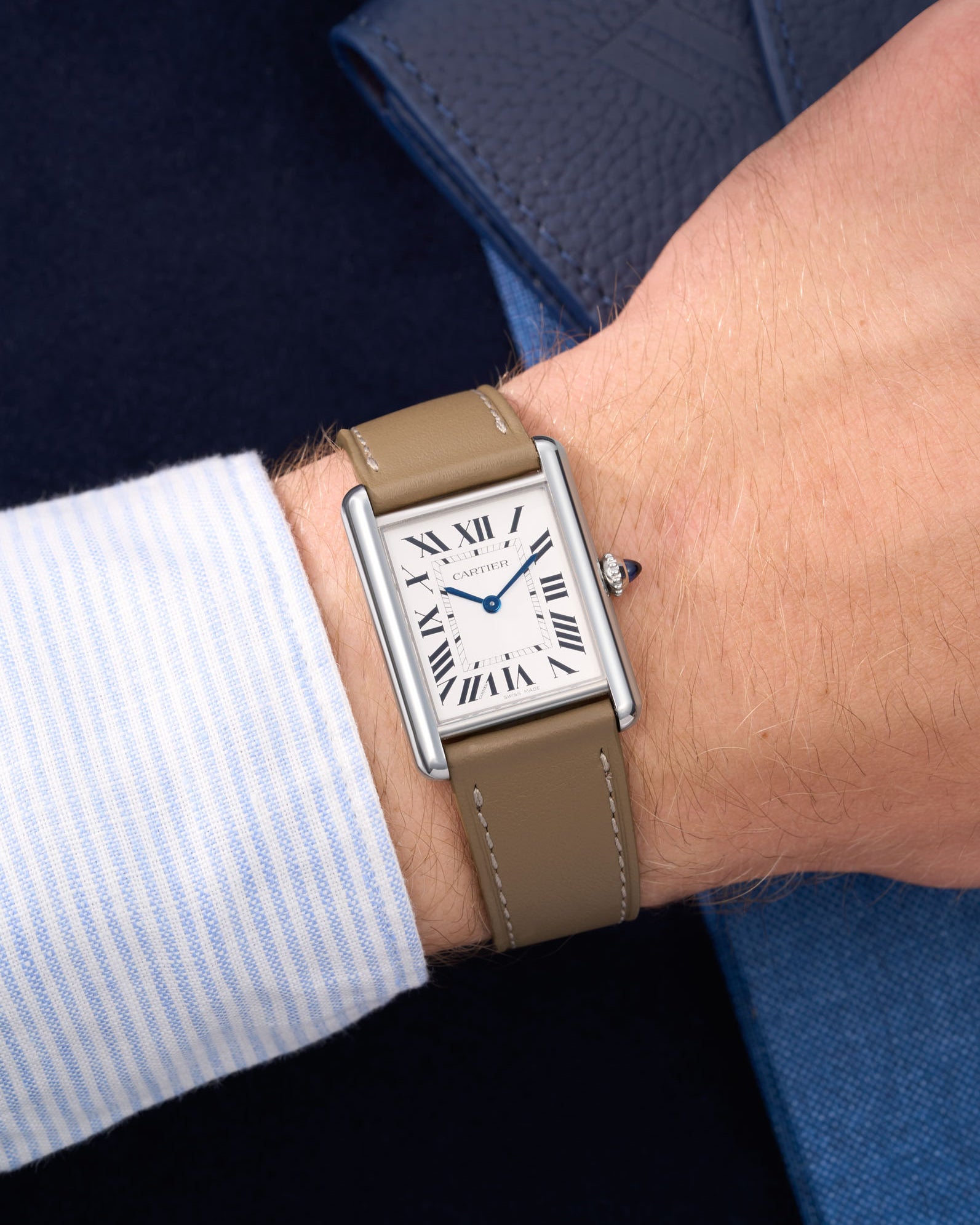 Taupe Cowhide Leather Straps for Cartier Tank Must Large wrist shot over blue table