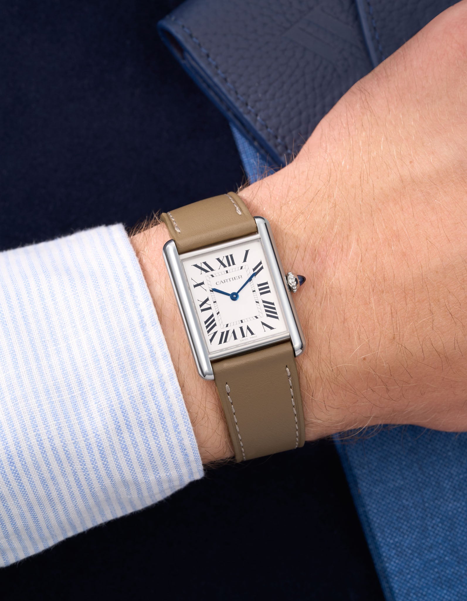Taupe Cowhide Leather Straps for Cartier Tank Must Large wrist shot over blue table