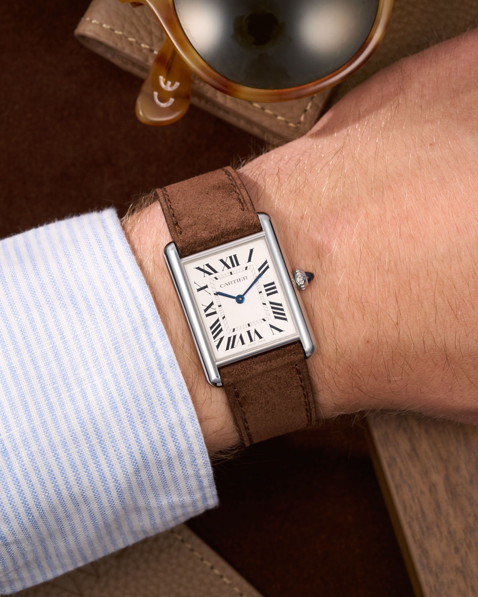 Brown Suede Leather Straps for Cartier Tank Must Large wrist shot over brown table