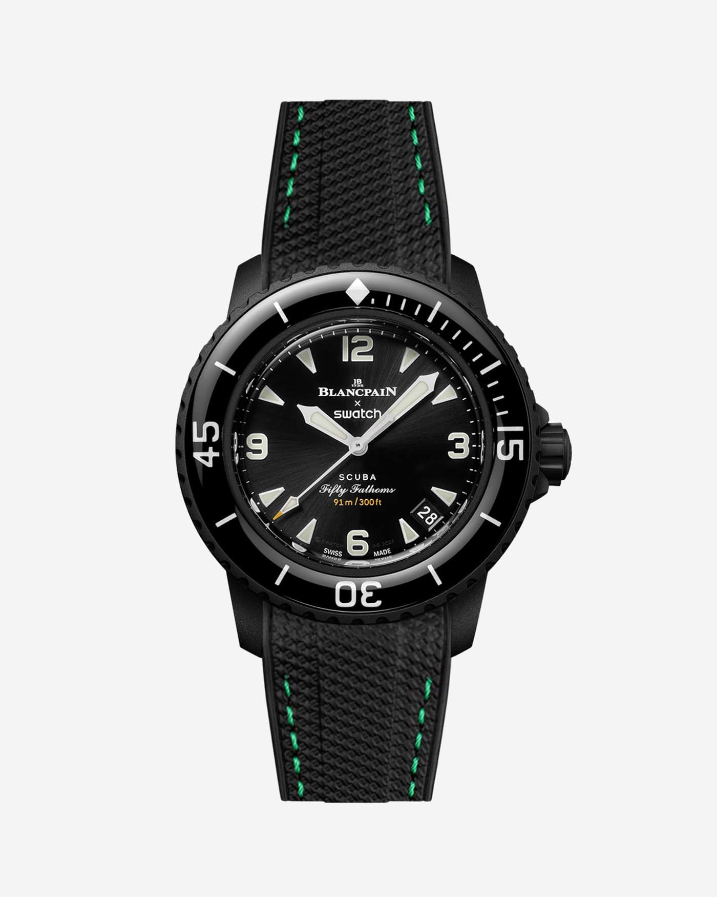 Blancpain X Swatch The Ocean of Storms diver watch displayed with black rubber strap with green stitches mounted