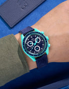 Omega X Swatch Mission on Earth Polar Lights with Dark Blue suede leather strap worn on wrist
