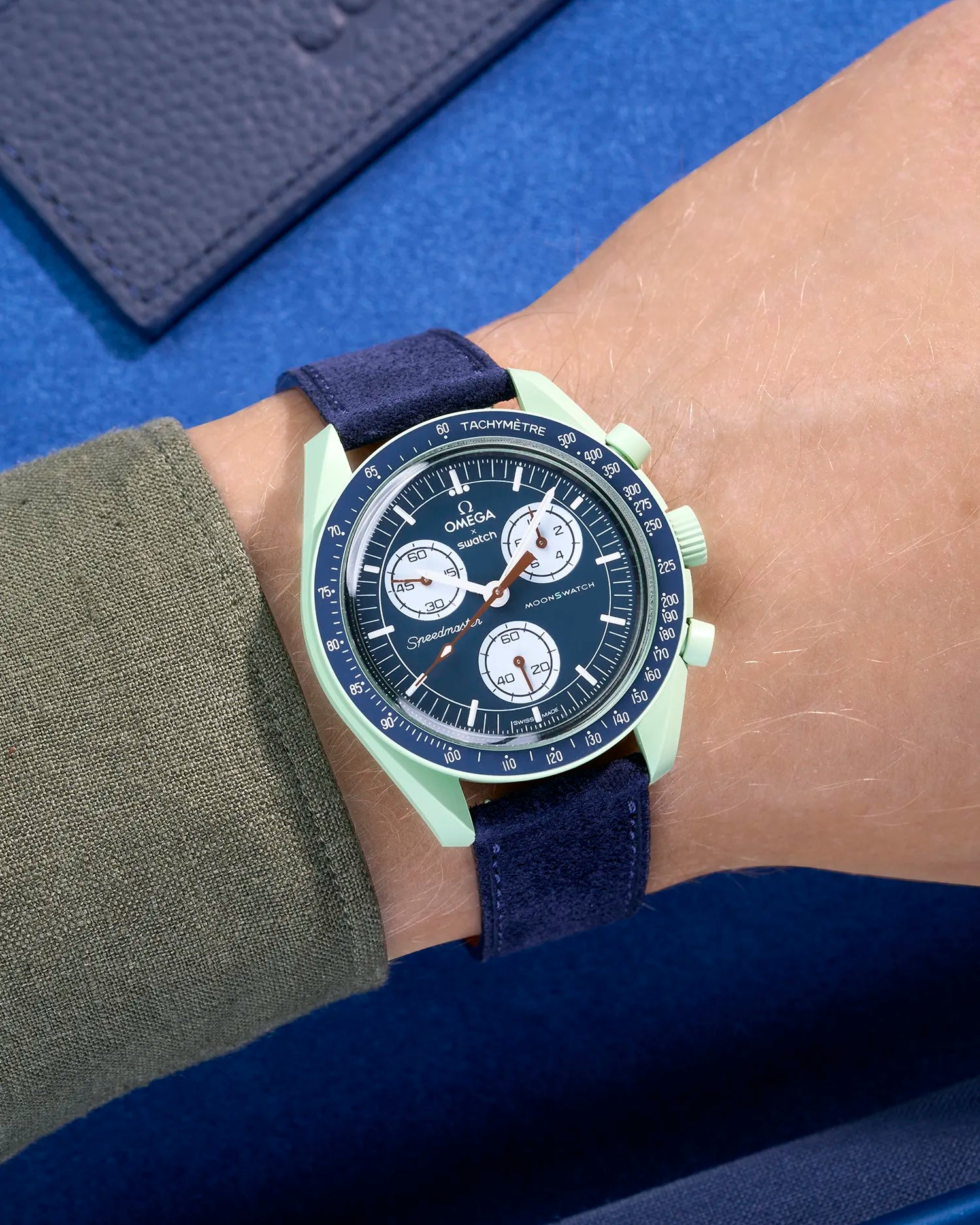 Omega X Swatch Mission on Earth with Dark Blue suede leather strap worn on wrist