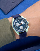 Omega X Swatch Mission on Earth with Dark Blue suede leather strap worn on wrist