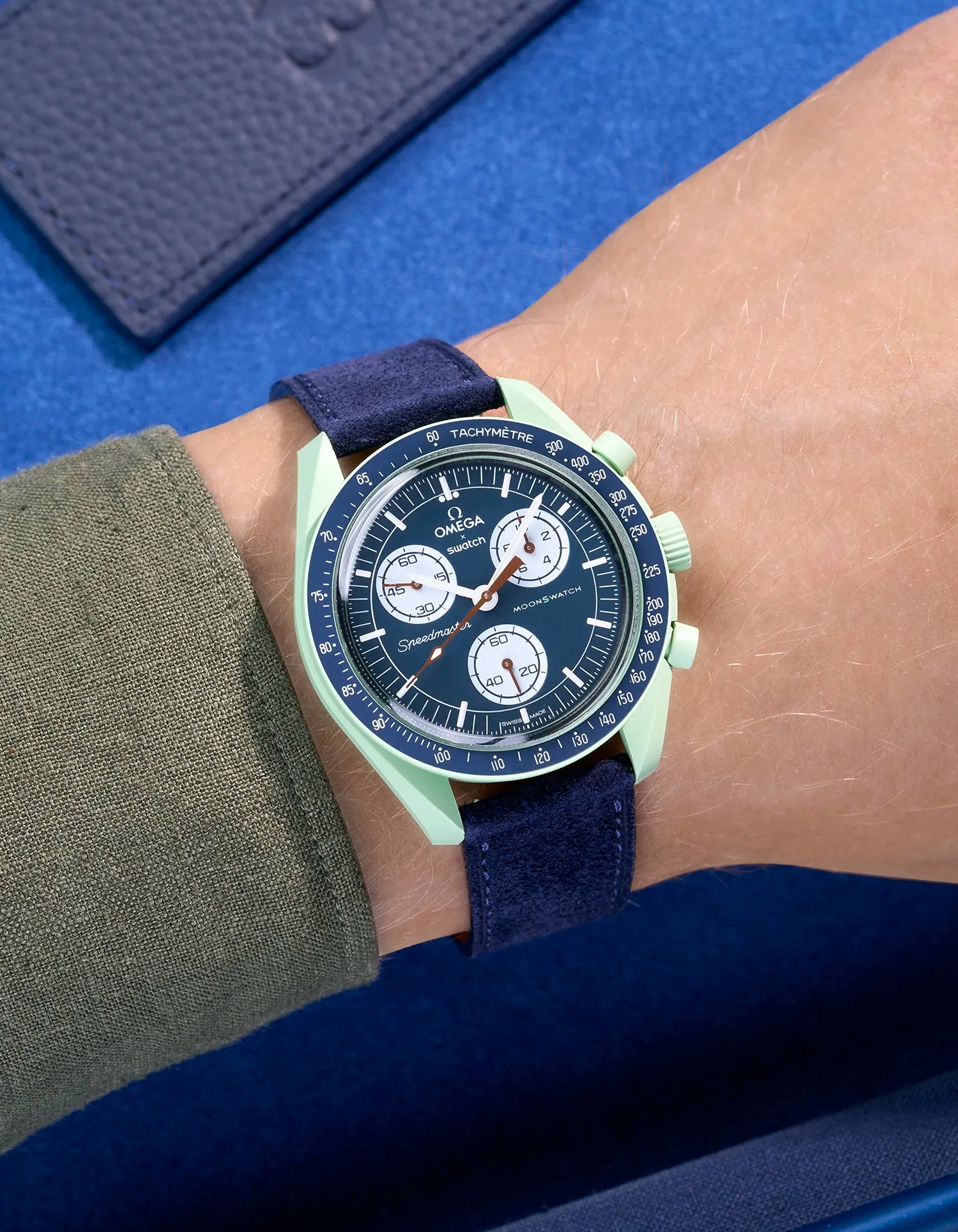 Omega X Swatch Mission on Earth with Dark Blue suede leather strap worn on wrist