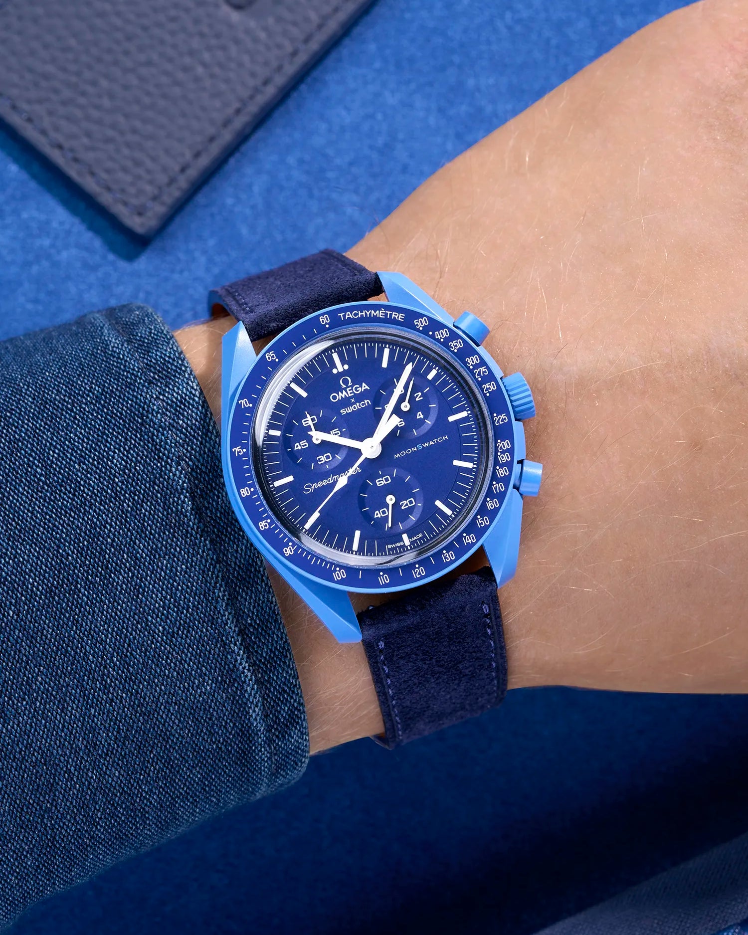 Omega X Swatch Mission to Neptune with Dark Blue suede leather strap worn on wrist