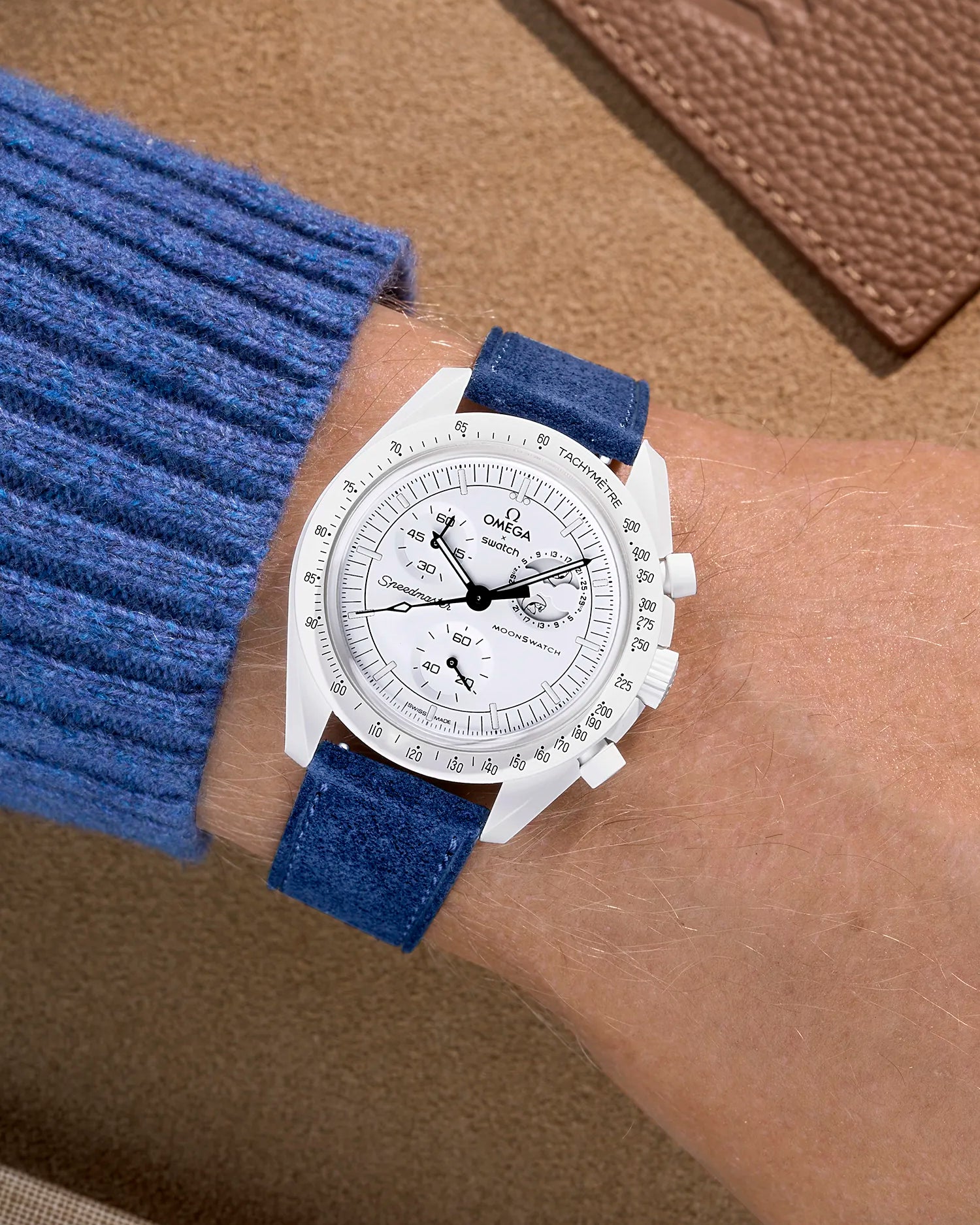 Omega X Swatch Mission to the Moonphase Full Moon with dark blue suede leather strap worn on wrist