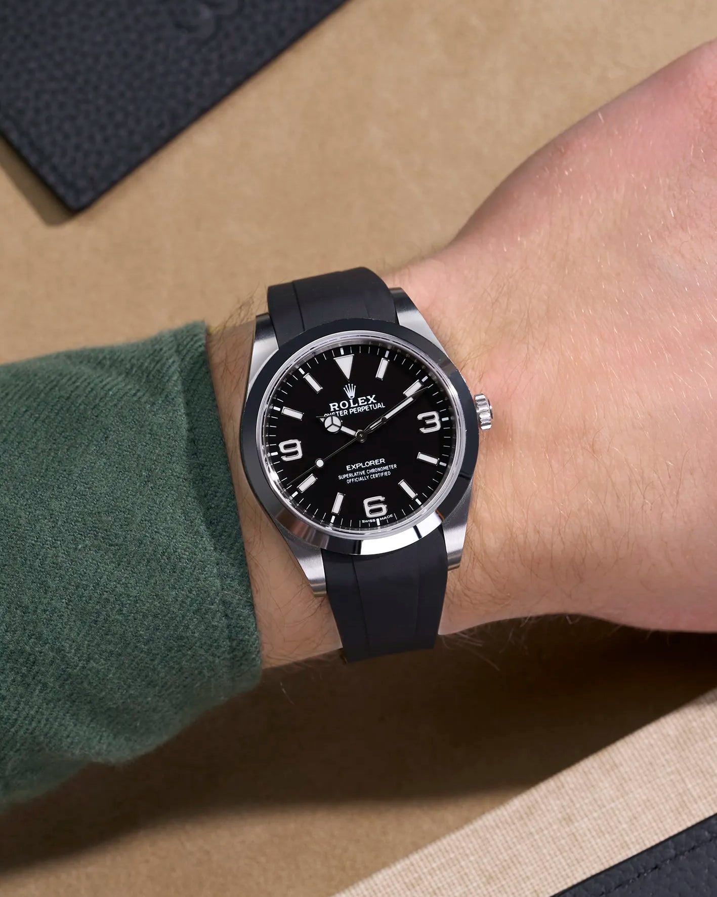 Wrist shot of Rolex Explorer 214270 fitted with black FKM rubber strap and original clasp integration