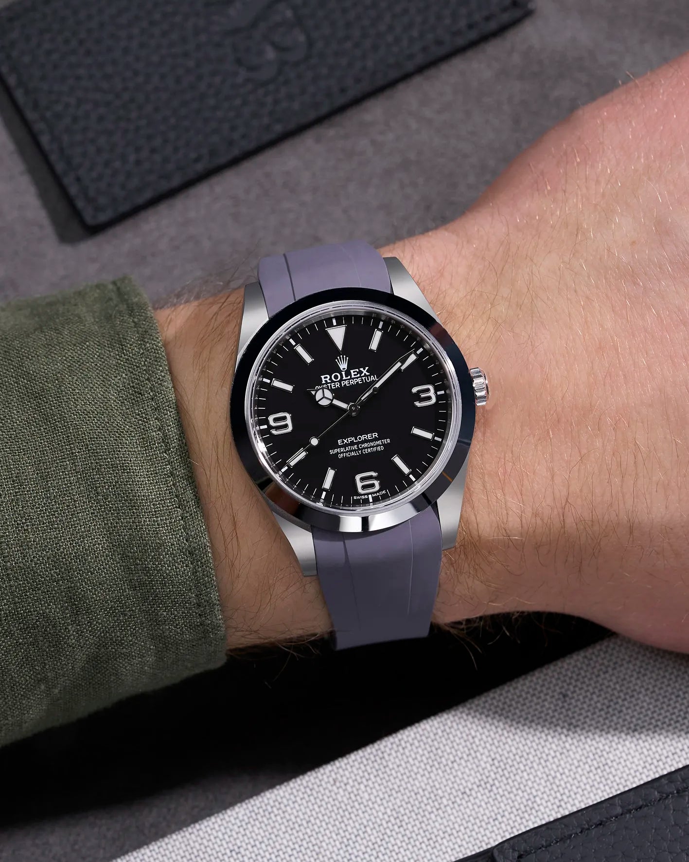 Grey rubber strap with original clasp on Rolex Explorer 214270 – wrist shot showcasing seamless fit