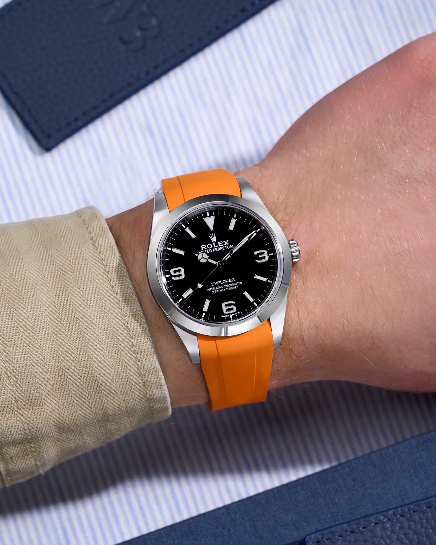 Orange rubber strap for Rolex Explorer 214270 integrated with original Rolex clasp – wrist shot for rugged elegance