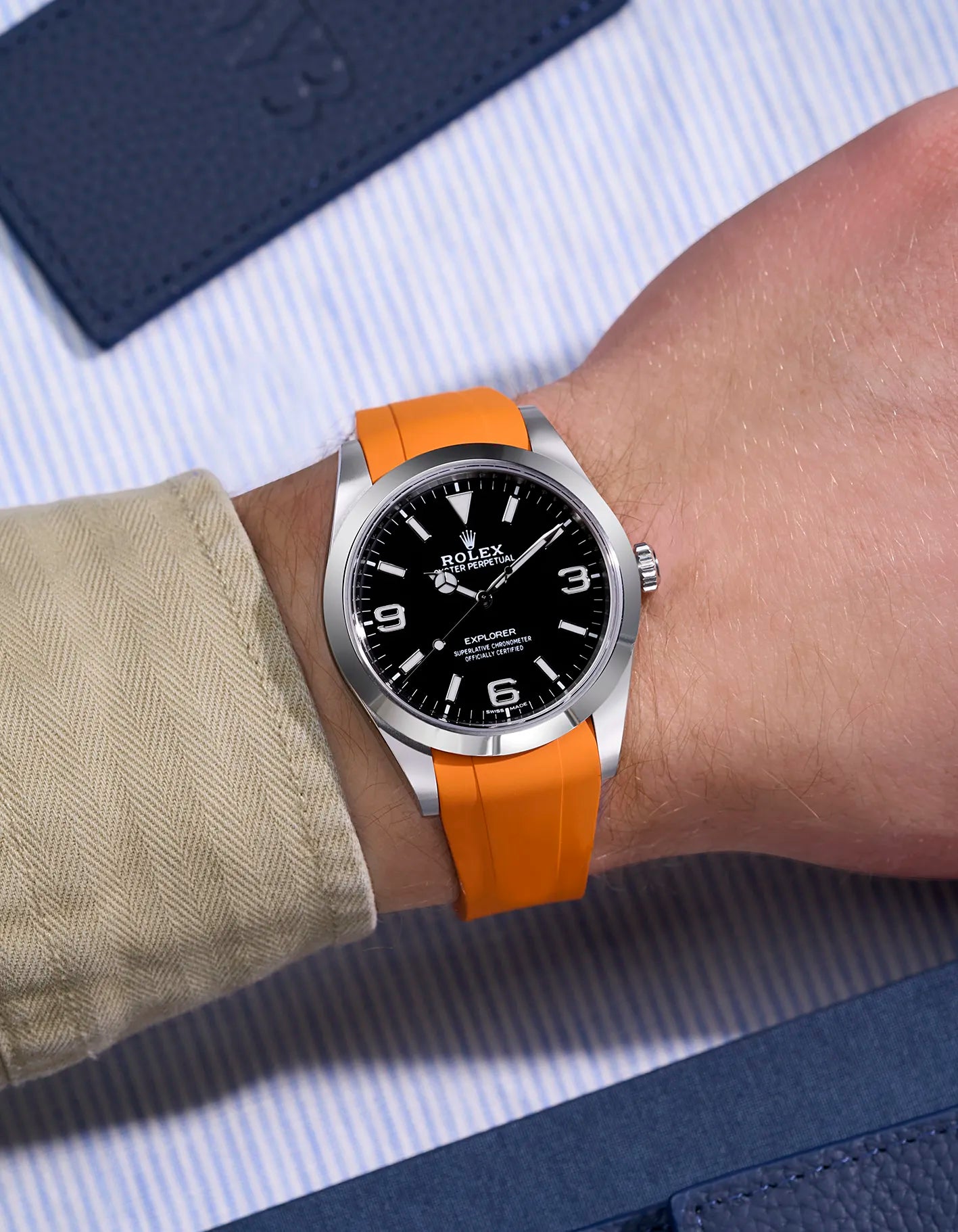 Orange rubber strap for Rolex Explorer 214270 integrated with original Rolex clasp – wrist shot for rugged elegance