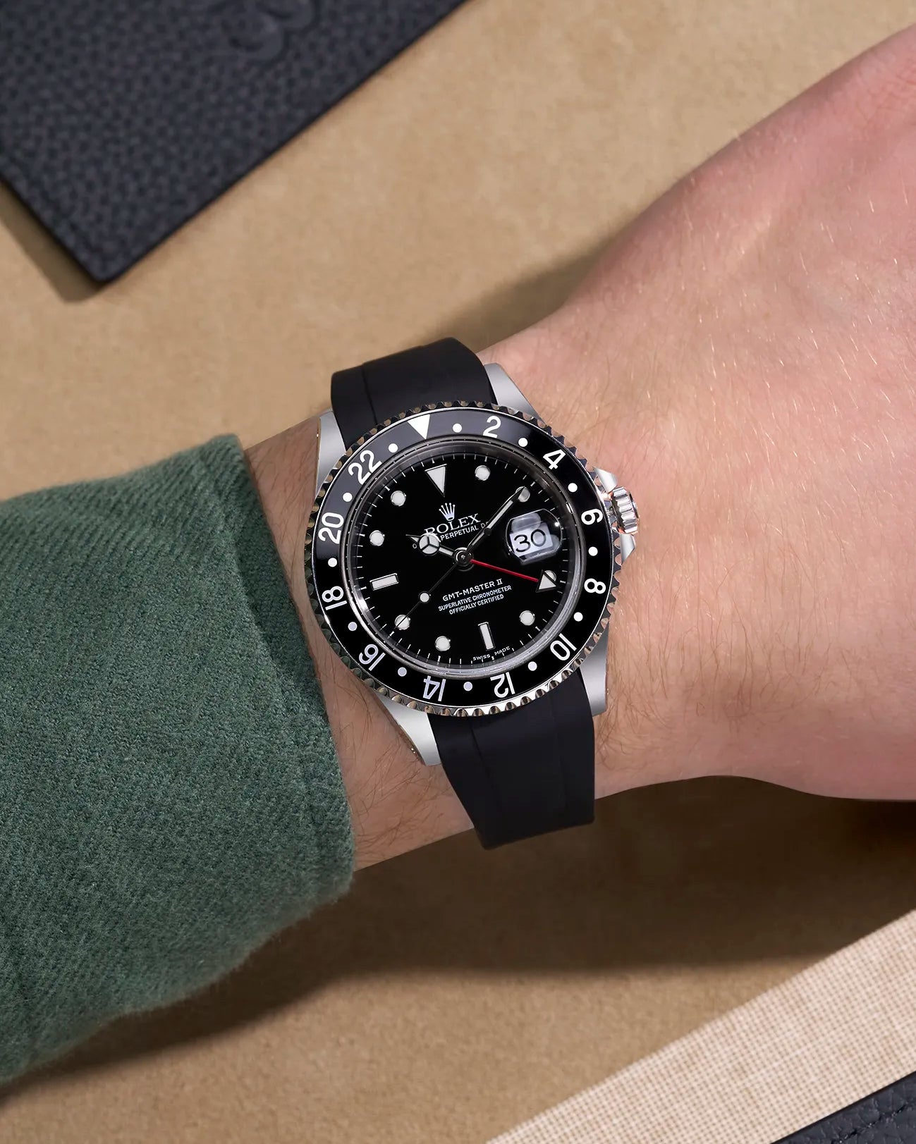 Wrist shot of Rolex GMT-Master II 16710 and 16713 with black rubber strap integrated with original Rolex clasp