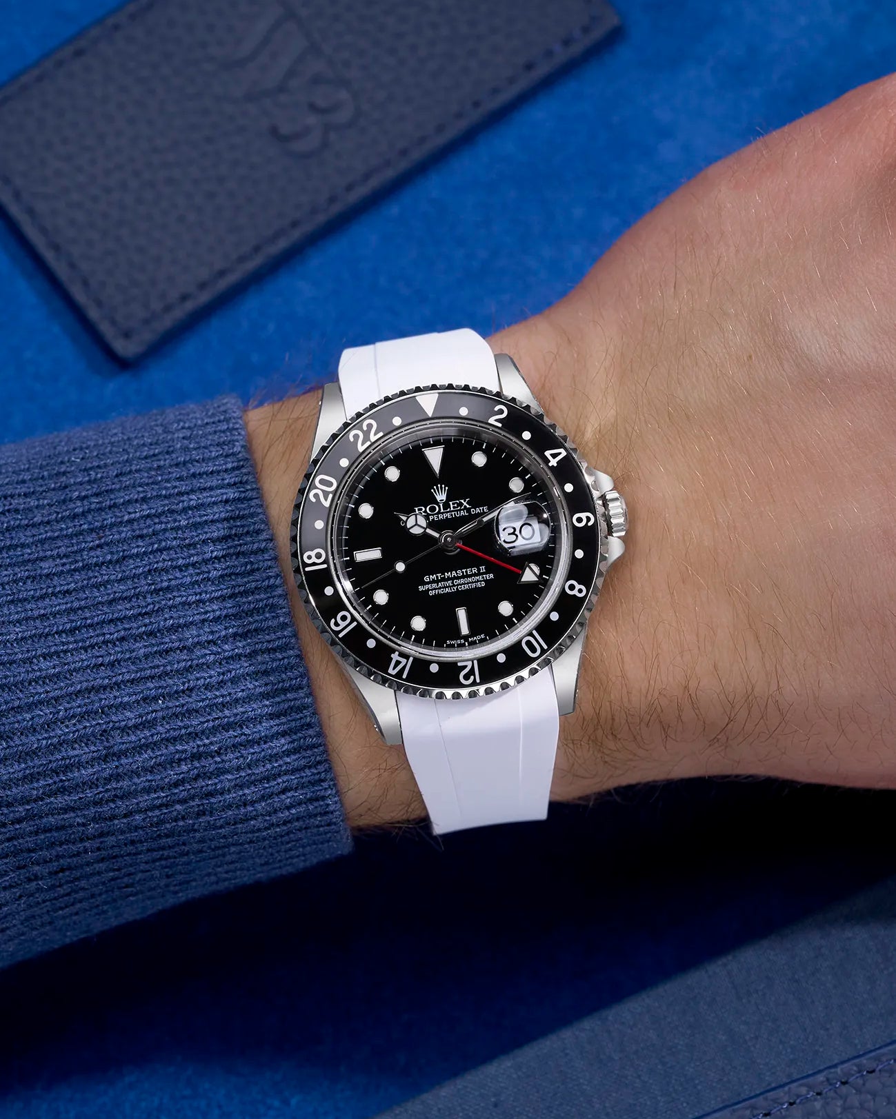 Wrist shot of Rolex GMT-Master II 16710 and 16713 wearing white rubber strap integrated with original Rolex clasp