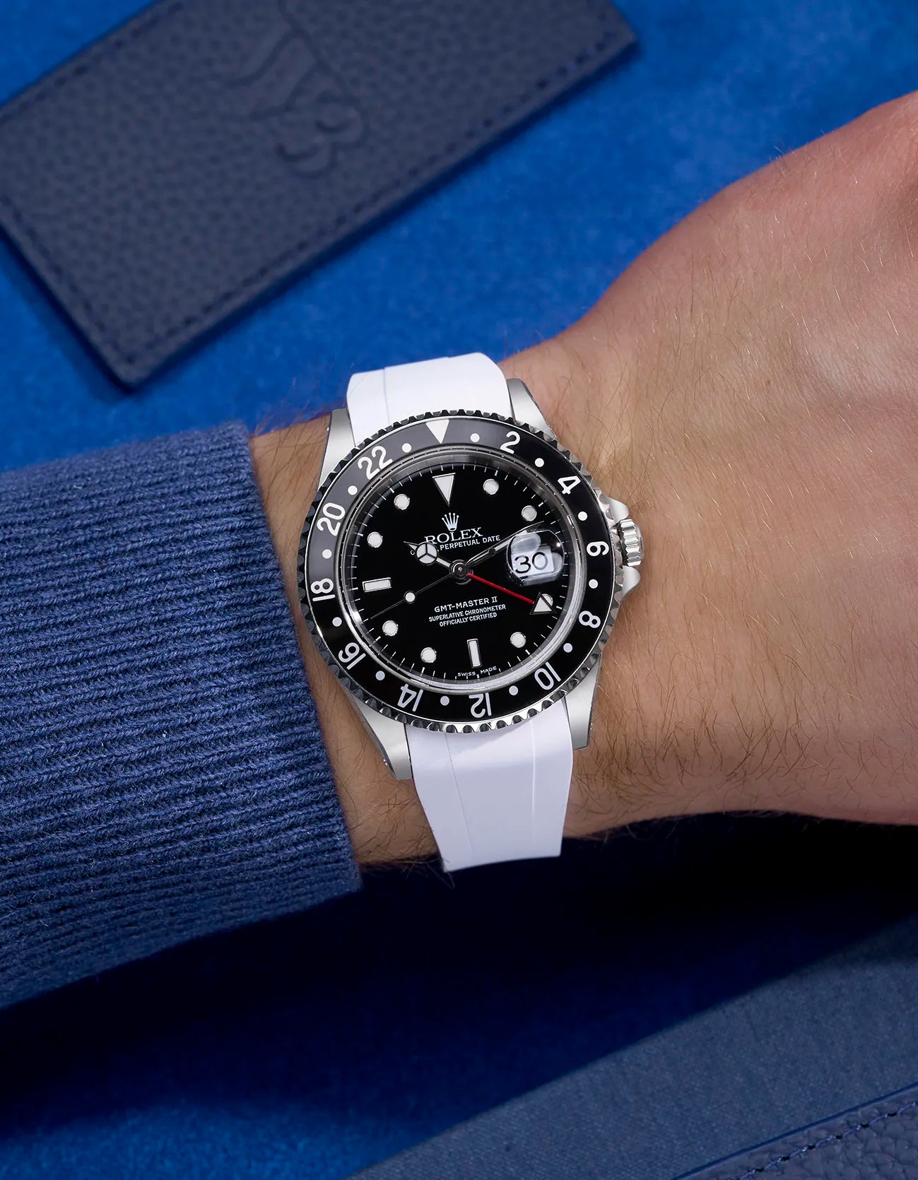 Wrist shot of Rolex GMT-Master II 16710 and 16713 wearing white rubber strap integrated with original Rolex clasp