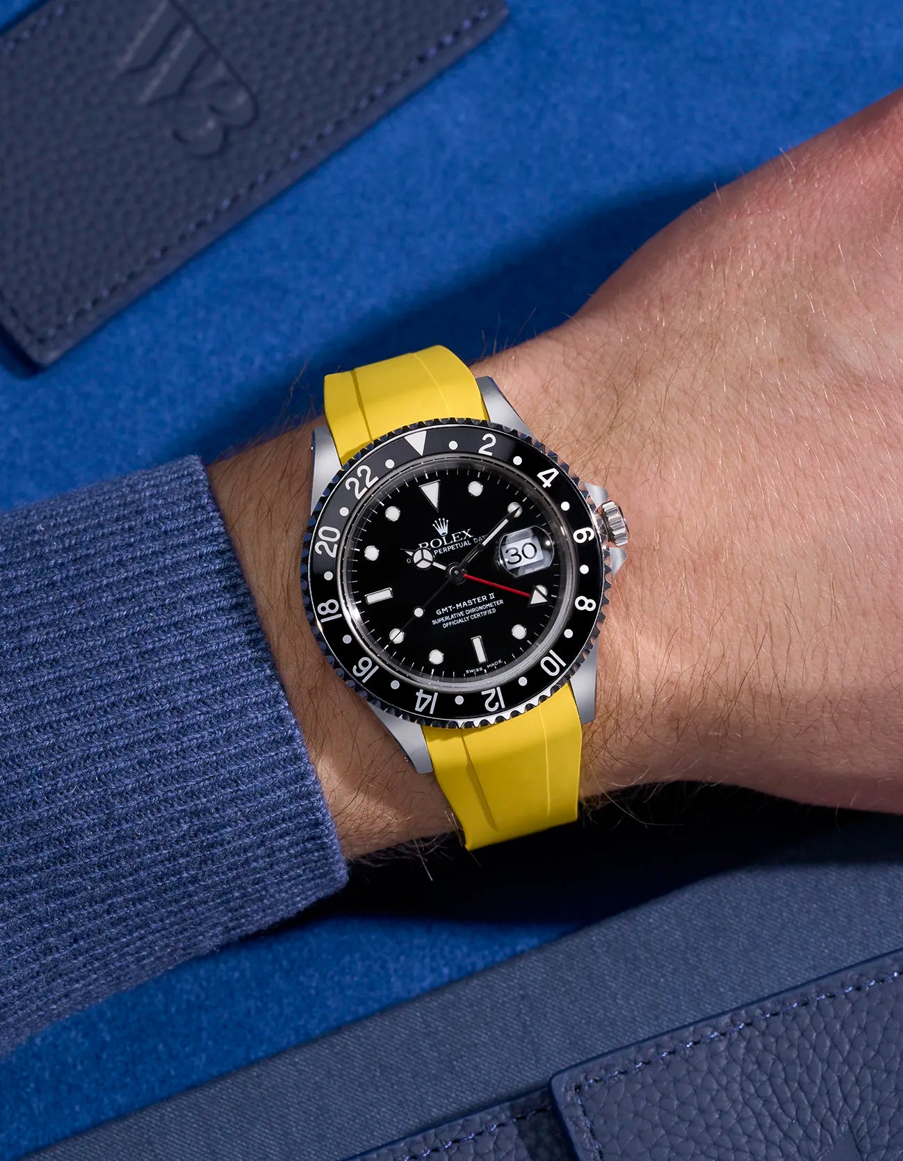 Wrist shot of Rolex GMT-Master II 16710 and 16713 on yellow FKM rubber strap with original clasp