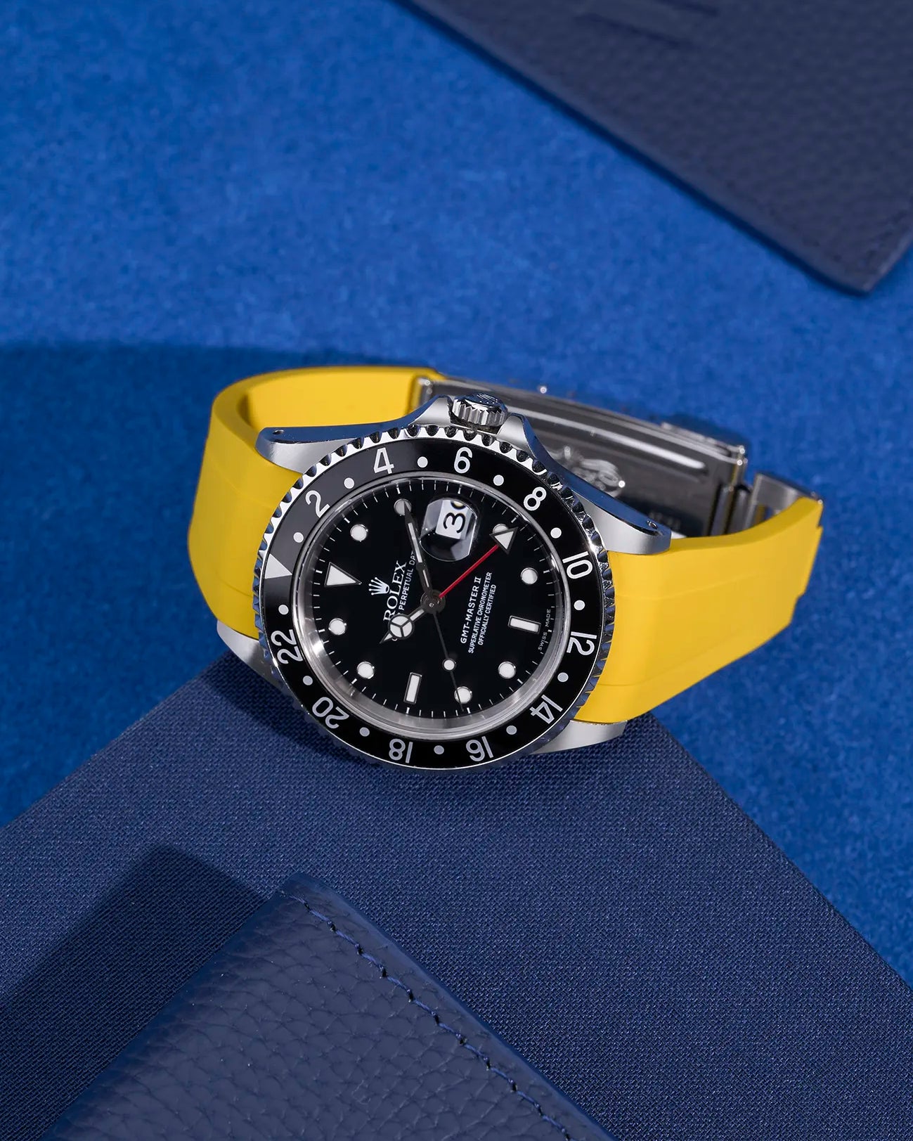 Yellow rubber strap on Rolex GMT-Master II 16710 and 16713 – fitted with original clasp, styled on blue background