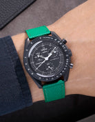 Green Epsom leather strap on Omega X Swatch MoonSwatch Mission to the Moonphase New Moon worn on wrist