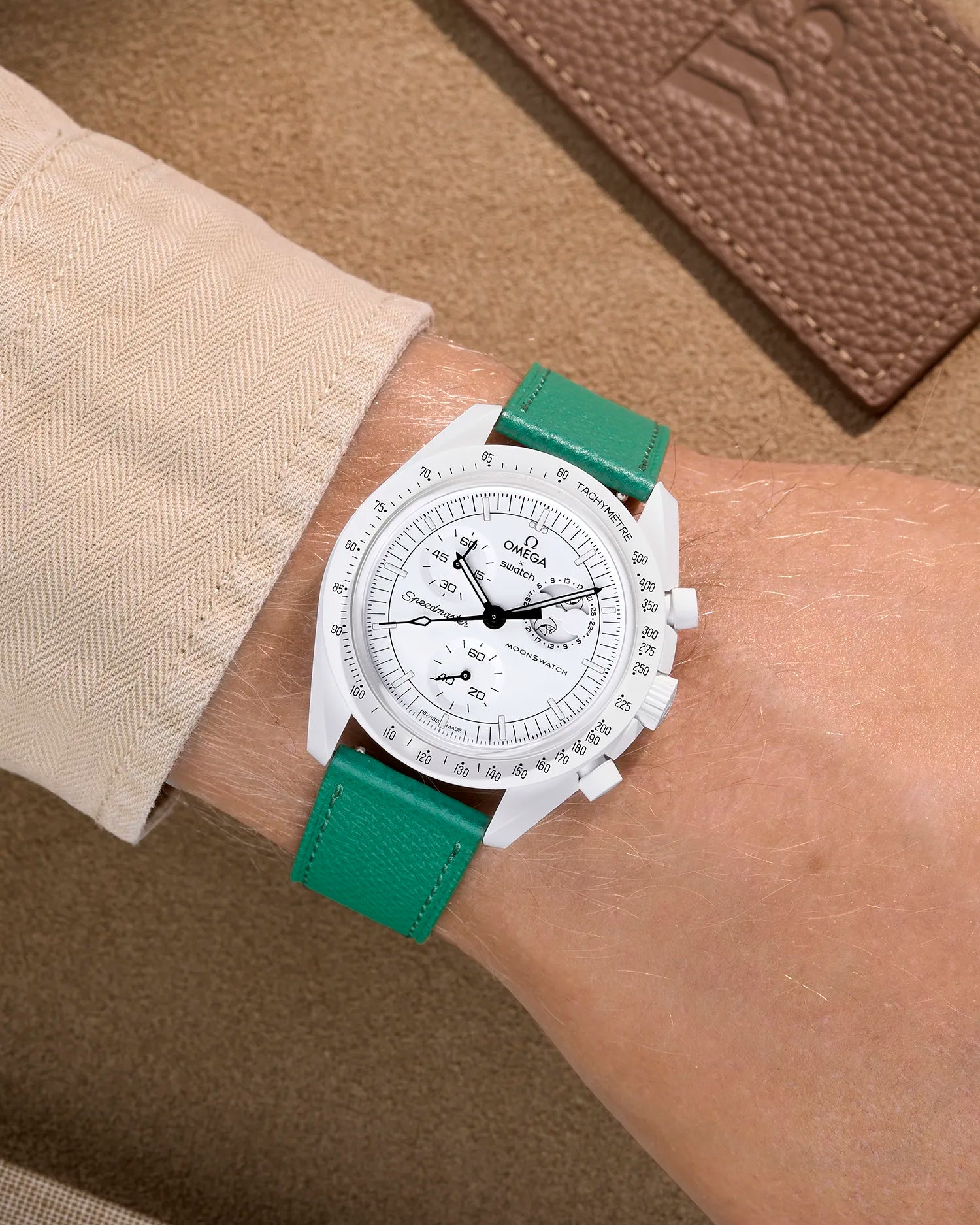 Omega X Swatch Mission to the Moonphase Full Moon with Green epsom leather strap worn on wrist