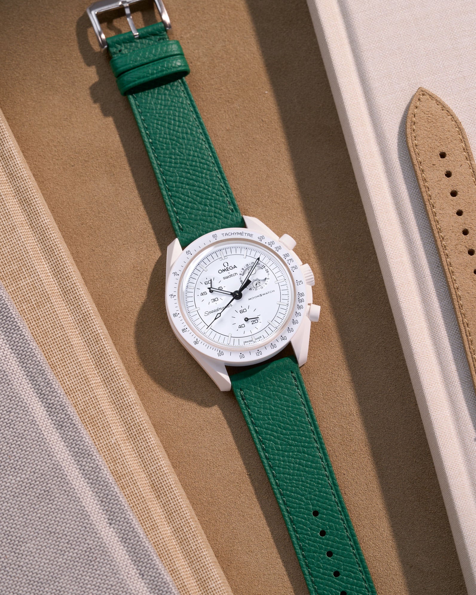 Flat lay of Green Epsom leather strap for Omega x Swatch MoonSwatch Mission to the Moonphase Full Moon
