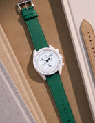 Flat lay of Green Epsom leather strap for Omega x Swatch MoonSwatch Mission to the Moonphase Full Moon