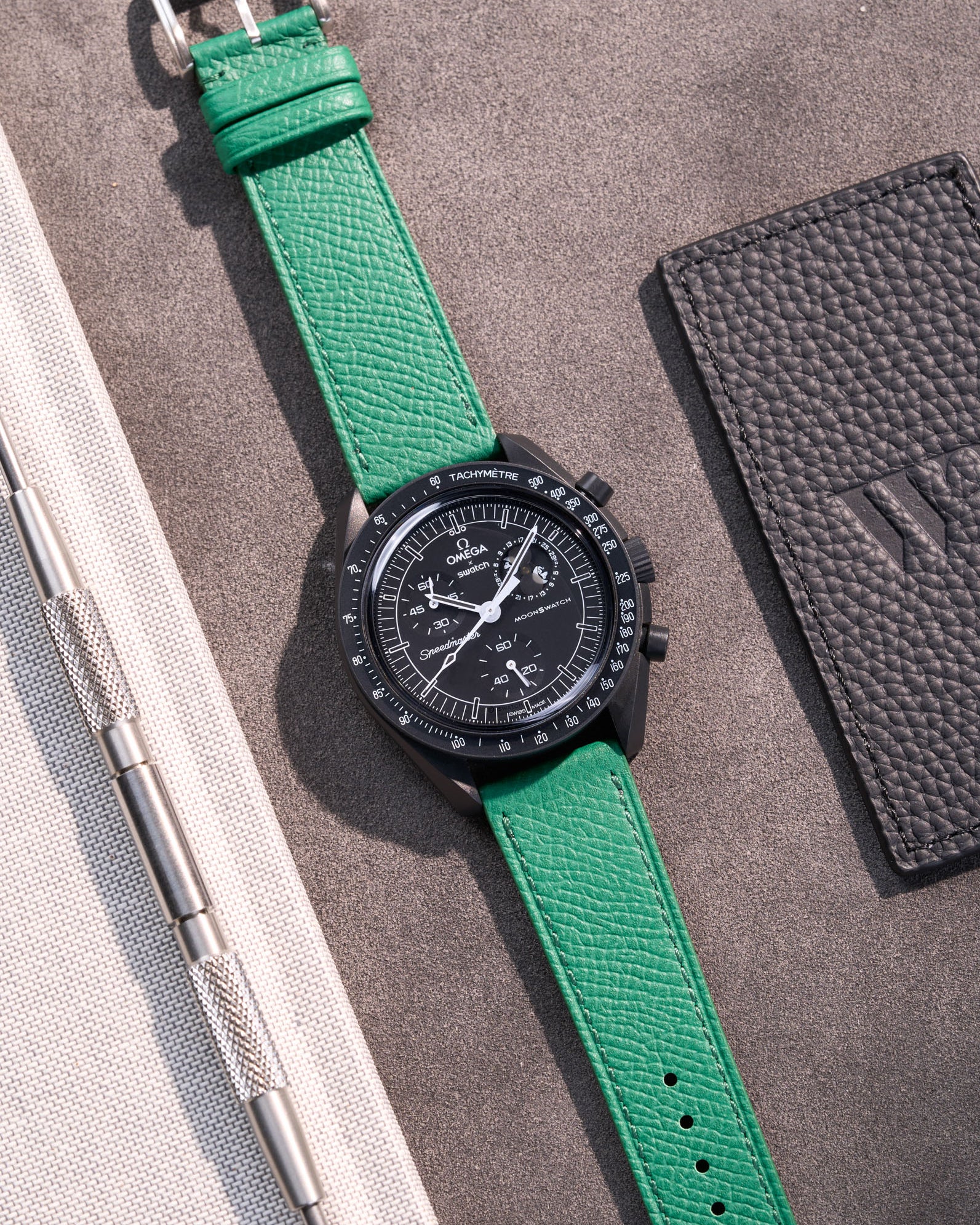 Flat lay of Green Epsom leather strap for Omega x Swatch MoonSwatch Mission to the Moonphase New Moon