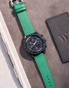 Flat lay of Green Epsom leather strap for Omega x Swatch MoonSwatch Mission to the Moonphase New Moon