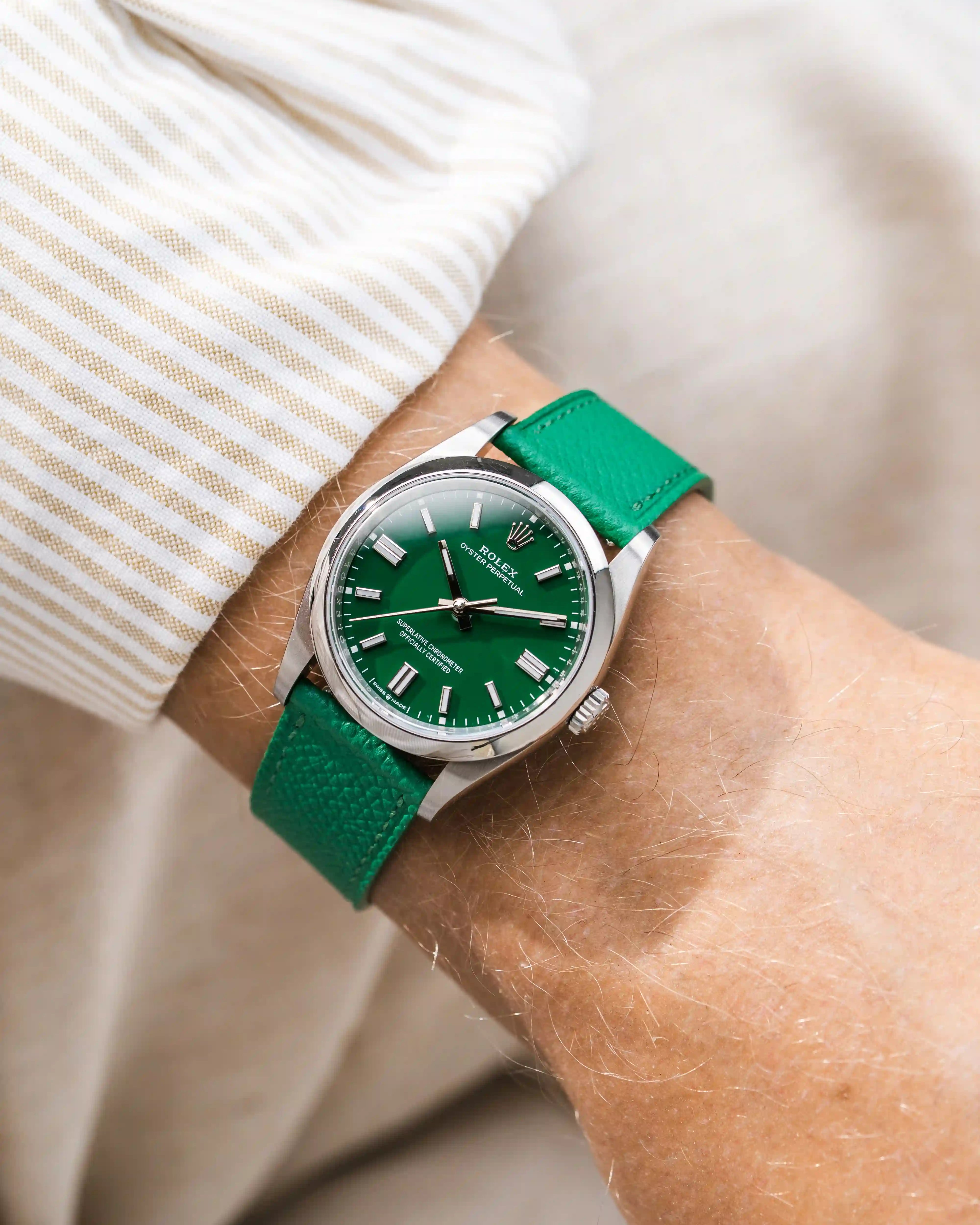 Green Epsom leather straps on Rolex OP wrist shot with beige shirt