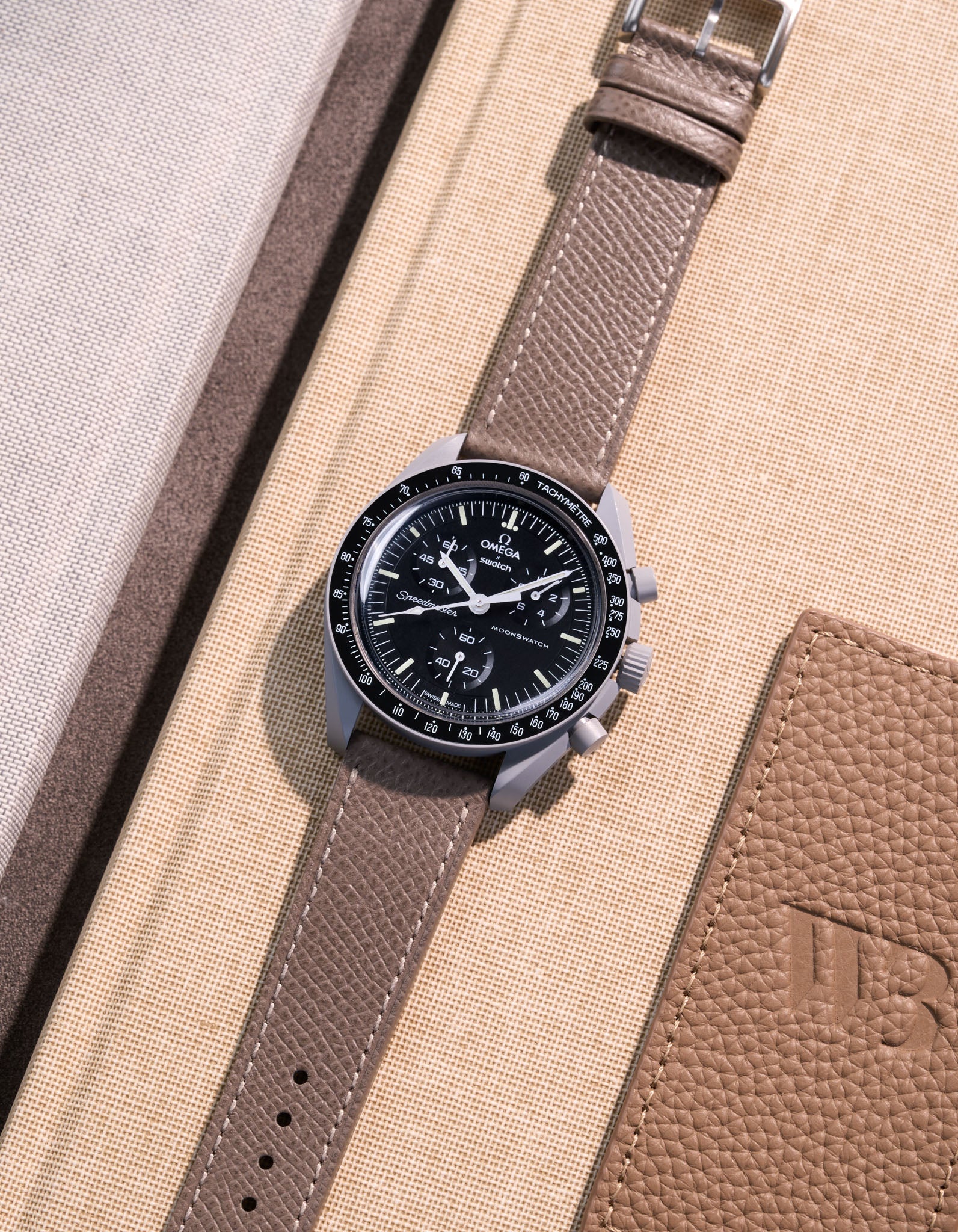 Flat lay of Grey Epsom leather strap for Omega x Swatch MoonSwatch Mission to the Moon