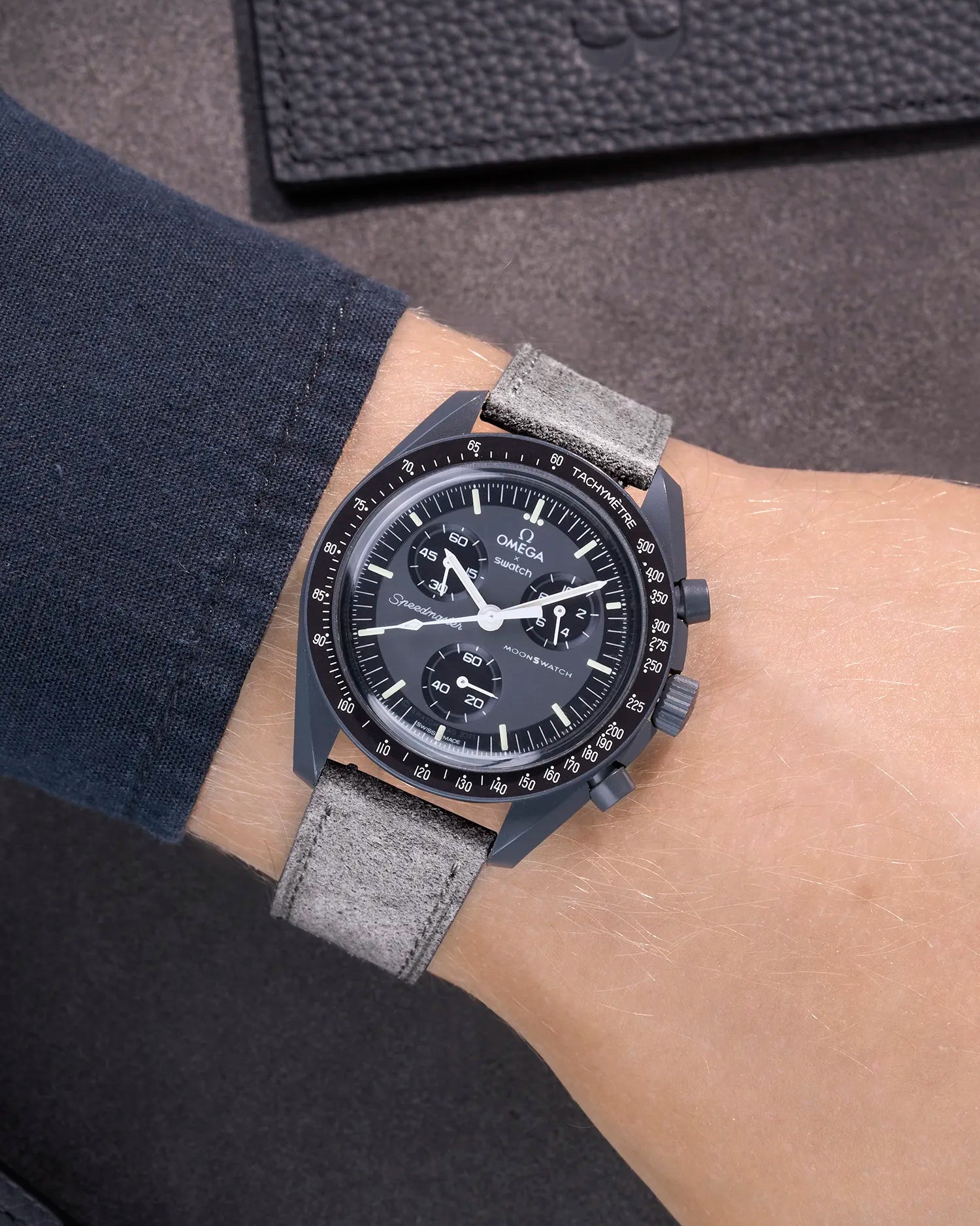 Omega X Swatch Mission to Mercury with Grey suede leather strap worn on wrist