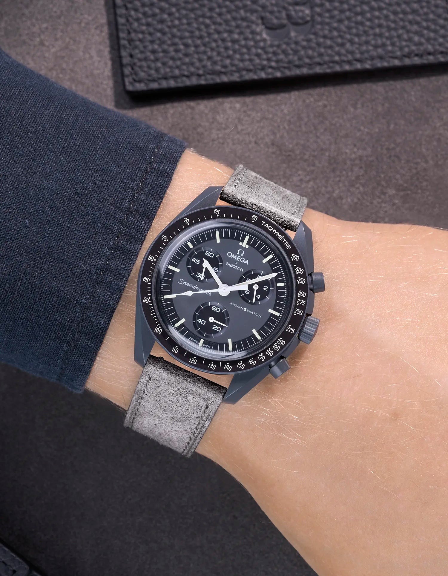 Omega X Swatch Mission to Mercury with Grey suede leather strap worn on wrist