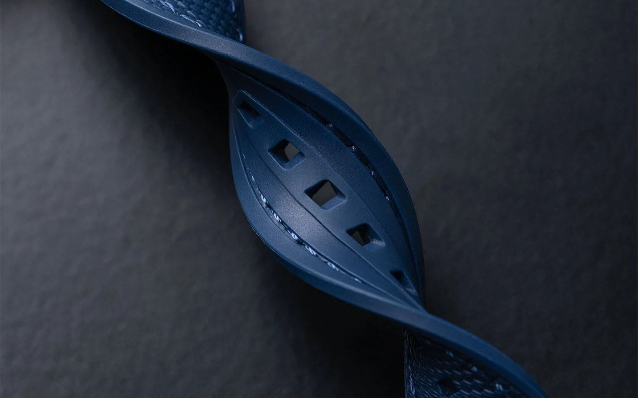 Close-up of blue rubber watch strap from Wristbuddys highlighting surface finish, flexibility, and inspection quality