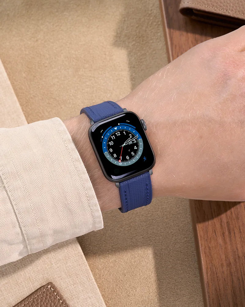 Wrist shot of an Navy Blue Rubber Apple Watch Band with a flexible and secure rubber band