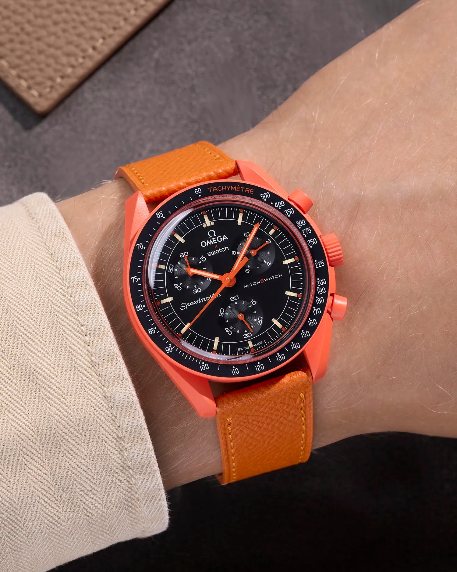 Orange Epsom leather strap on Omega X Swatch MoonSwatch Mission on Earth Lava – wrist shot