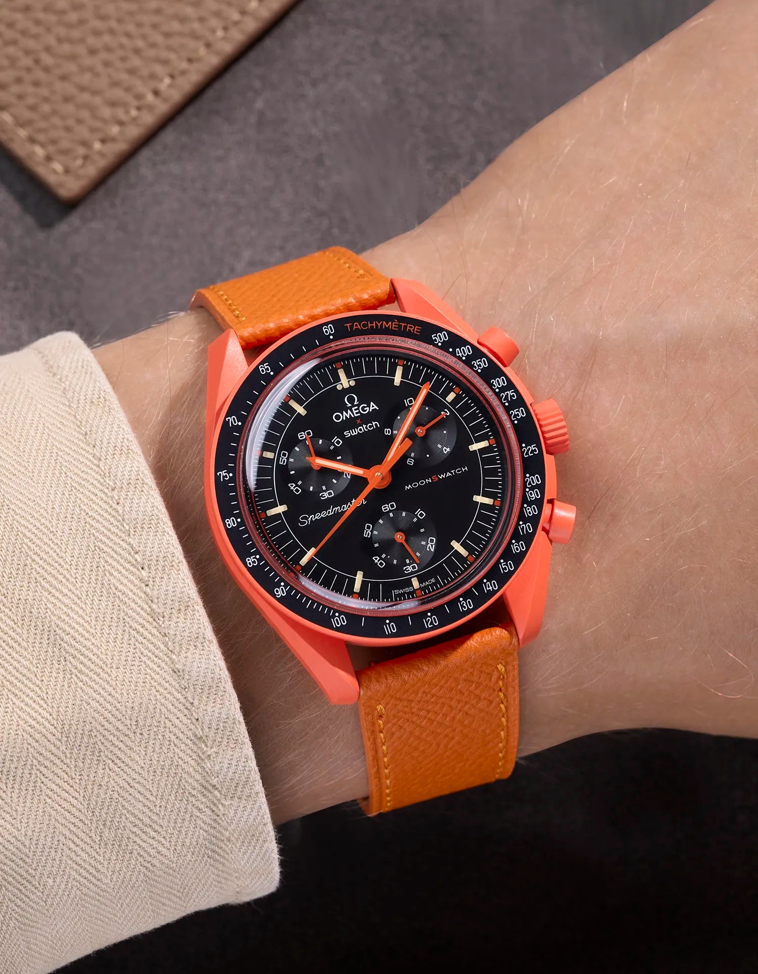 Orange Epsom leather strap on Omega X Swatch MoonSwatch Mission on Earth Lava – wrist shot