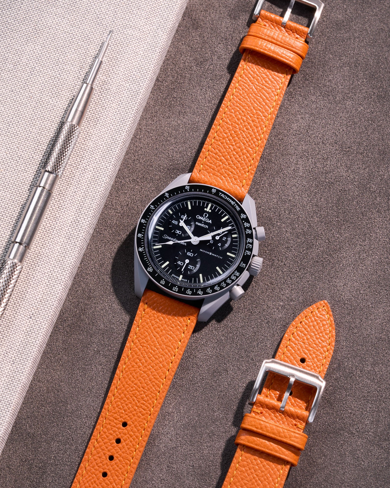 Flat lay of Orange Epsom leather strap for Omega x Swatch MoonSwatch Mission to the Moon