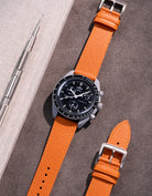 Flat lay of Orange Epsom leather strap for Omega x Swatch MoonSwatch Mission to the Moon