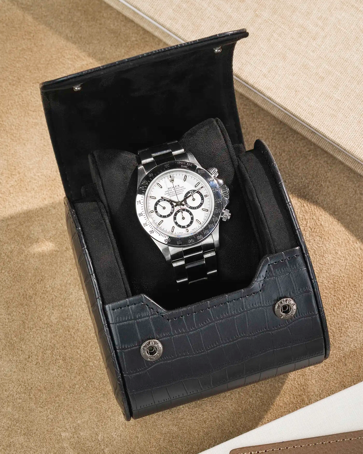 Opened Single Watch Roll  Black Embossed Alligator with a Rolex in