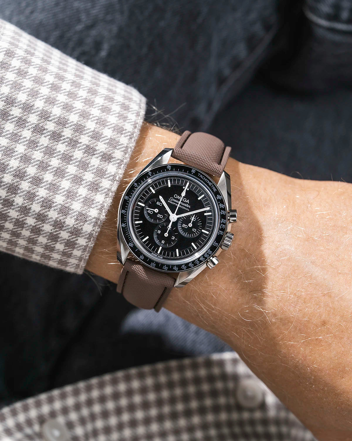 Brown Sailcloth FKM Rubber Strap With Deployant Clasp wrist shot on Omega Speedmaster watch