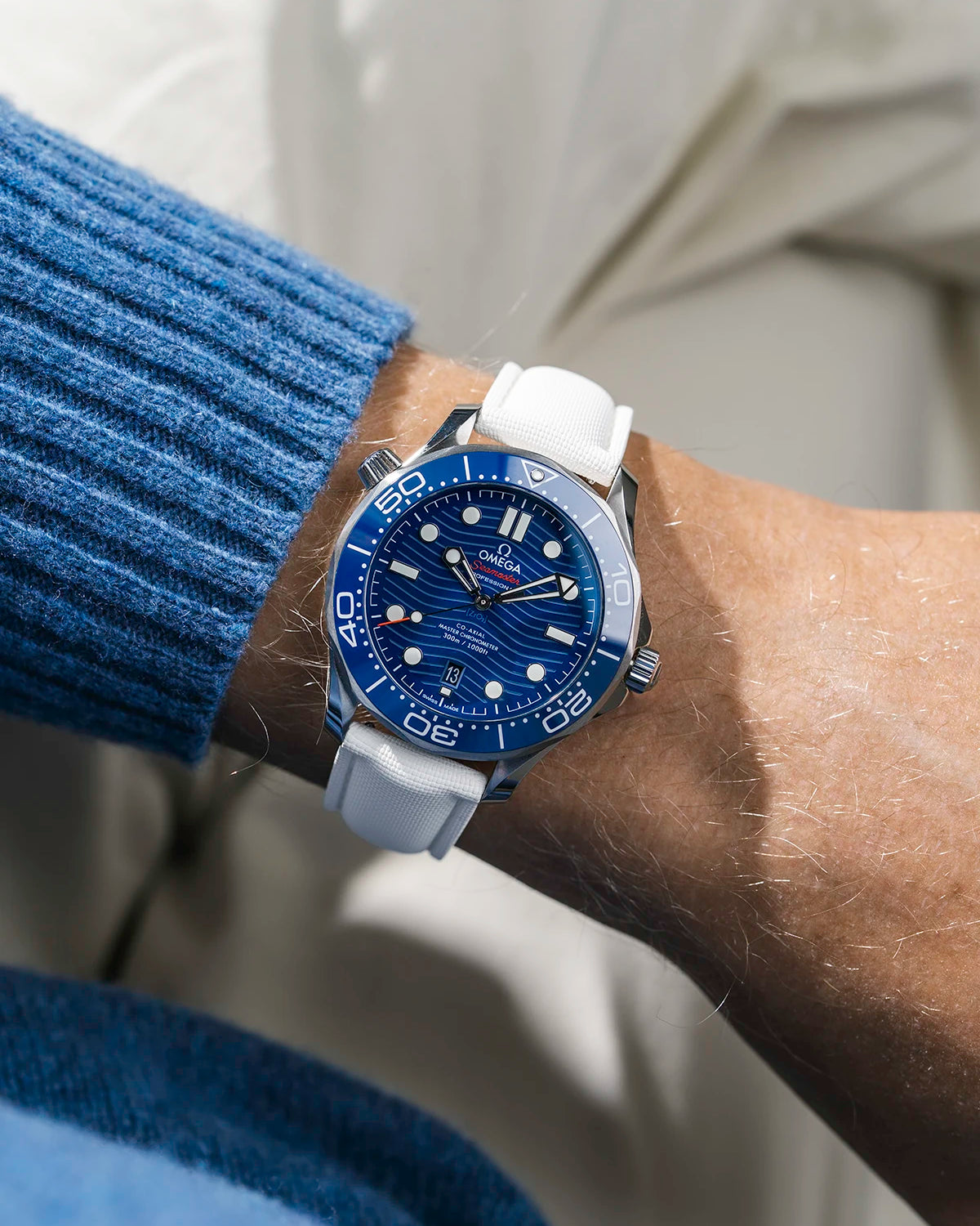 Sailcloth FKM Rubber Strap in White With Deployant Clasp wrist shot on Omega Seamaster watch