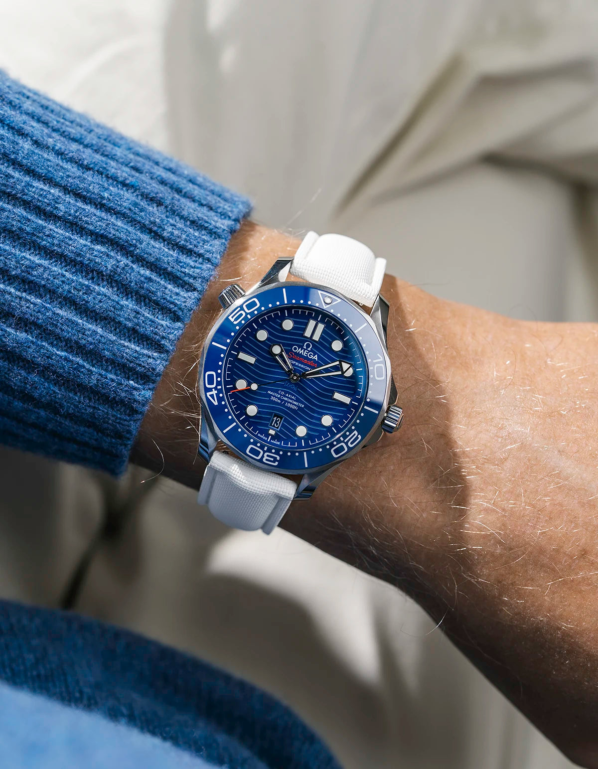 Sailcloth FKM Rubber Strap in White With Deployant Clasp wrist shot on Omega Seamaster watch