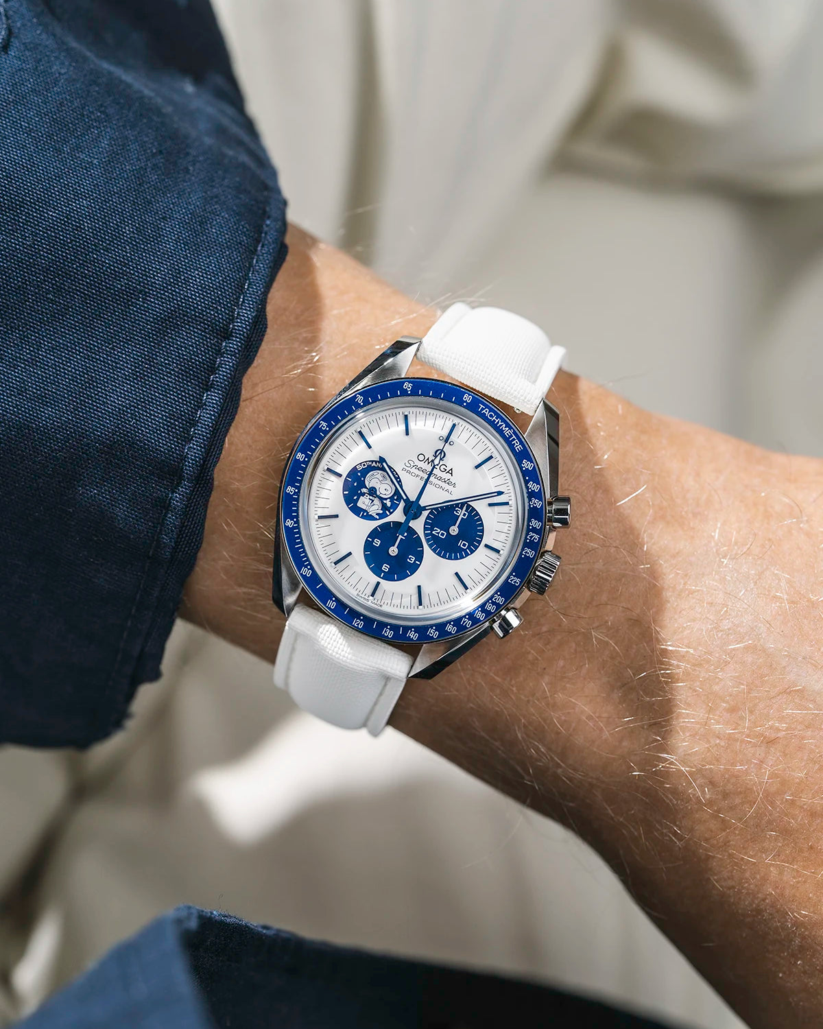 Sailcloth FKM Rubber Strap in White With Deployant Clasp wrist shot on Omega Speedmaster Snoopy watch