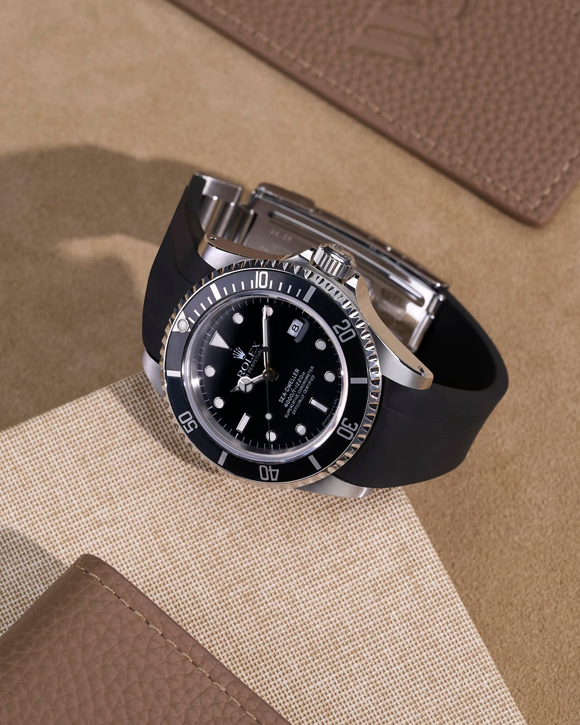 Black FKM rubber strap mounted on Rolex Sea-Dweller 16600, integrated with original clasp
