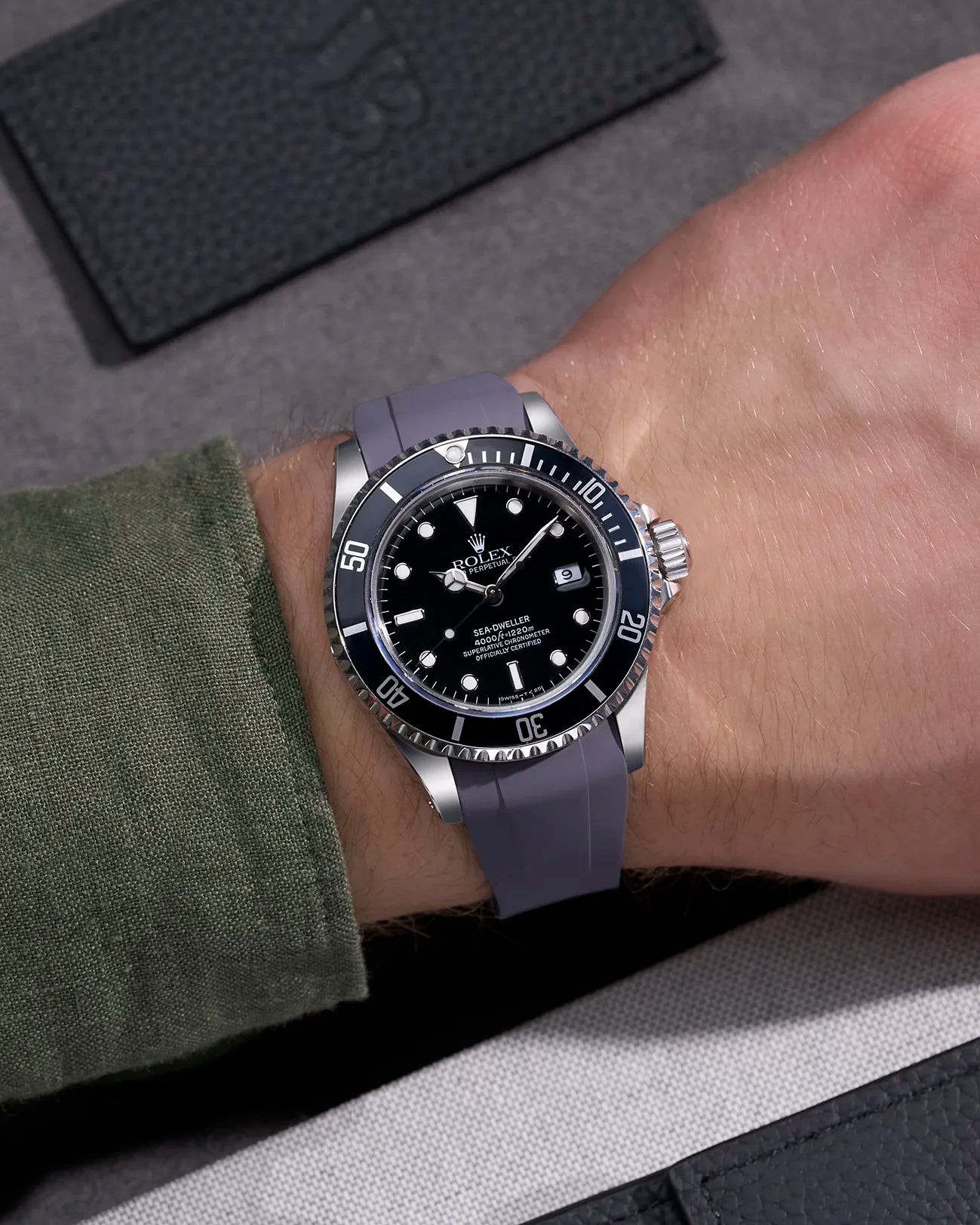 Wrist shot of Rolex Sea-Dweller 16600 on grey FKM rubber strap with original clasp for perfect fit